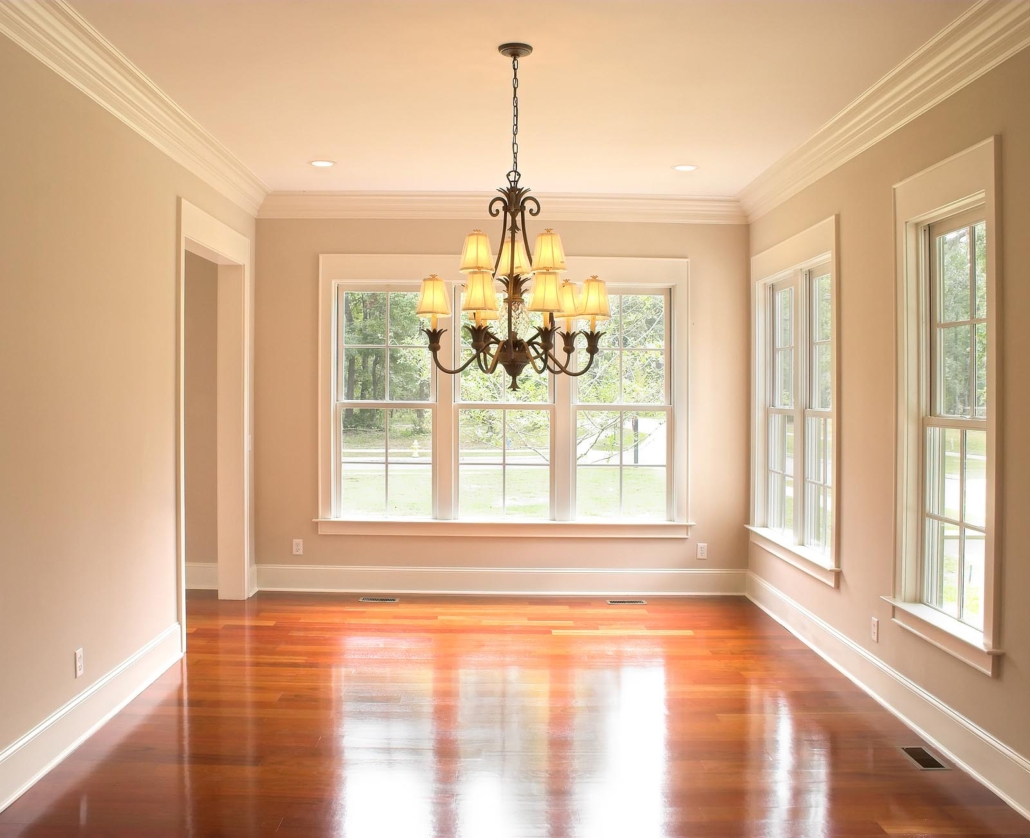 Unfurnished dining room with lots of windows and showing crown molding installation